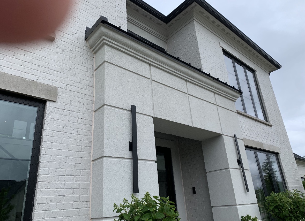 Modern painted brick home entry with black trim